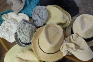 A pile of hats in different colors. Best protection from sun during winter. 