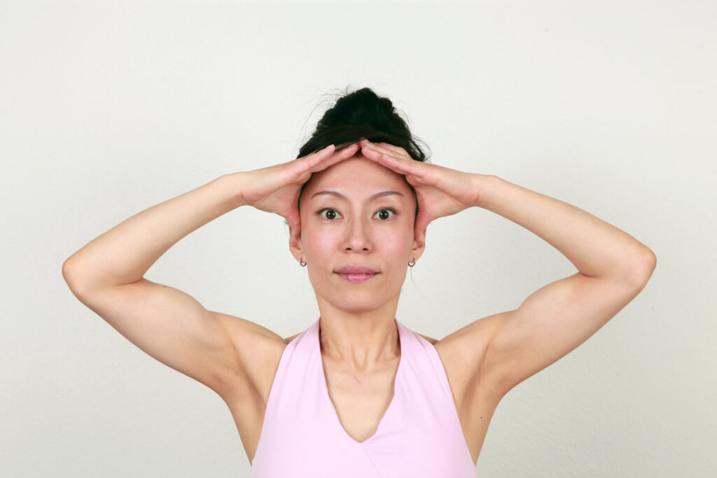 The Forehead Lift (With Body) Pose - Step 1